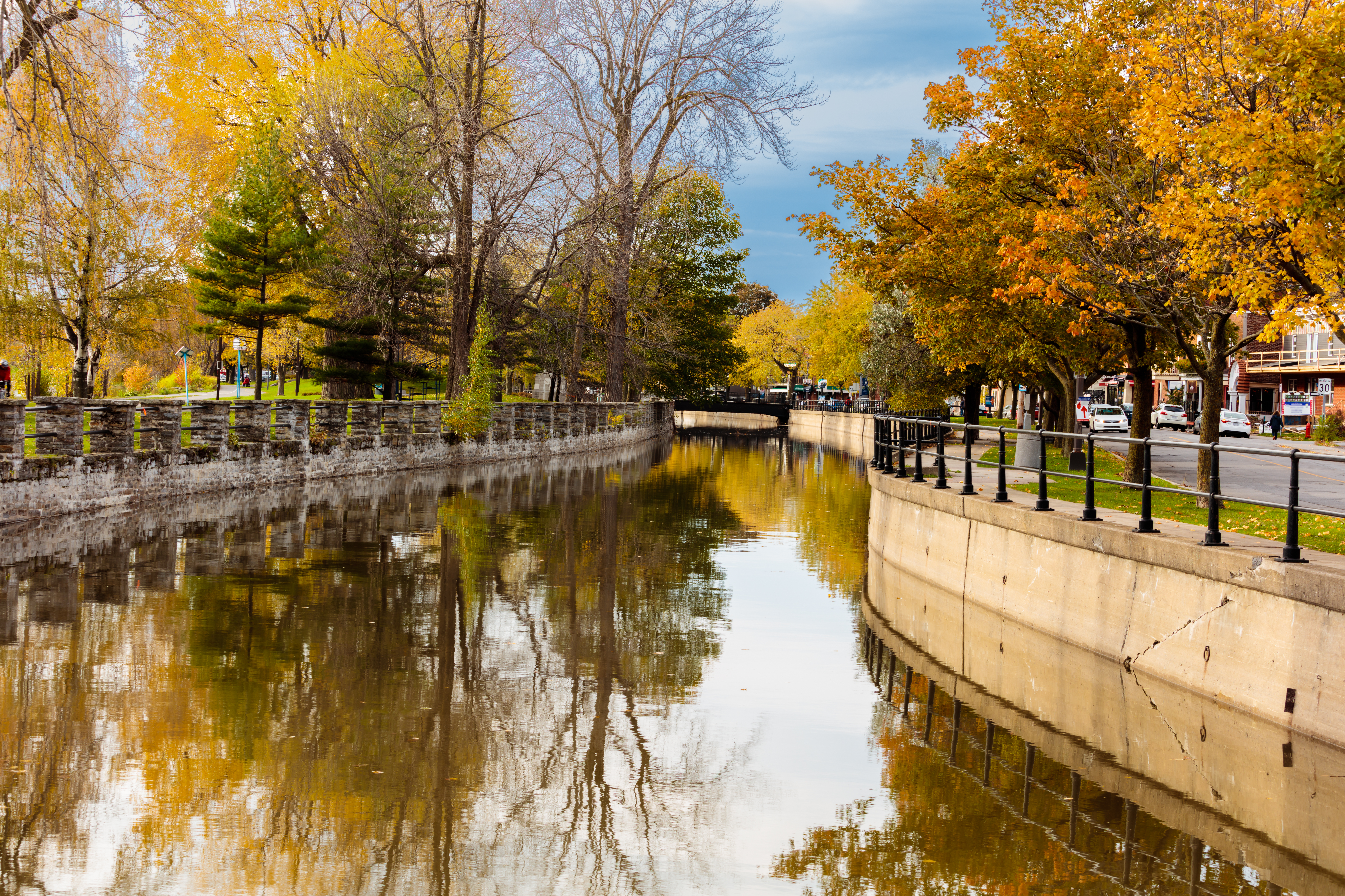 Lachine canal in late autumn with fall colors showing on the leaves in Quebec, Canada