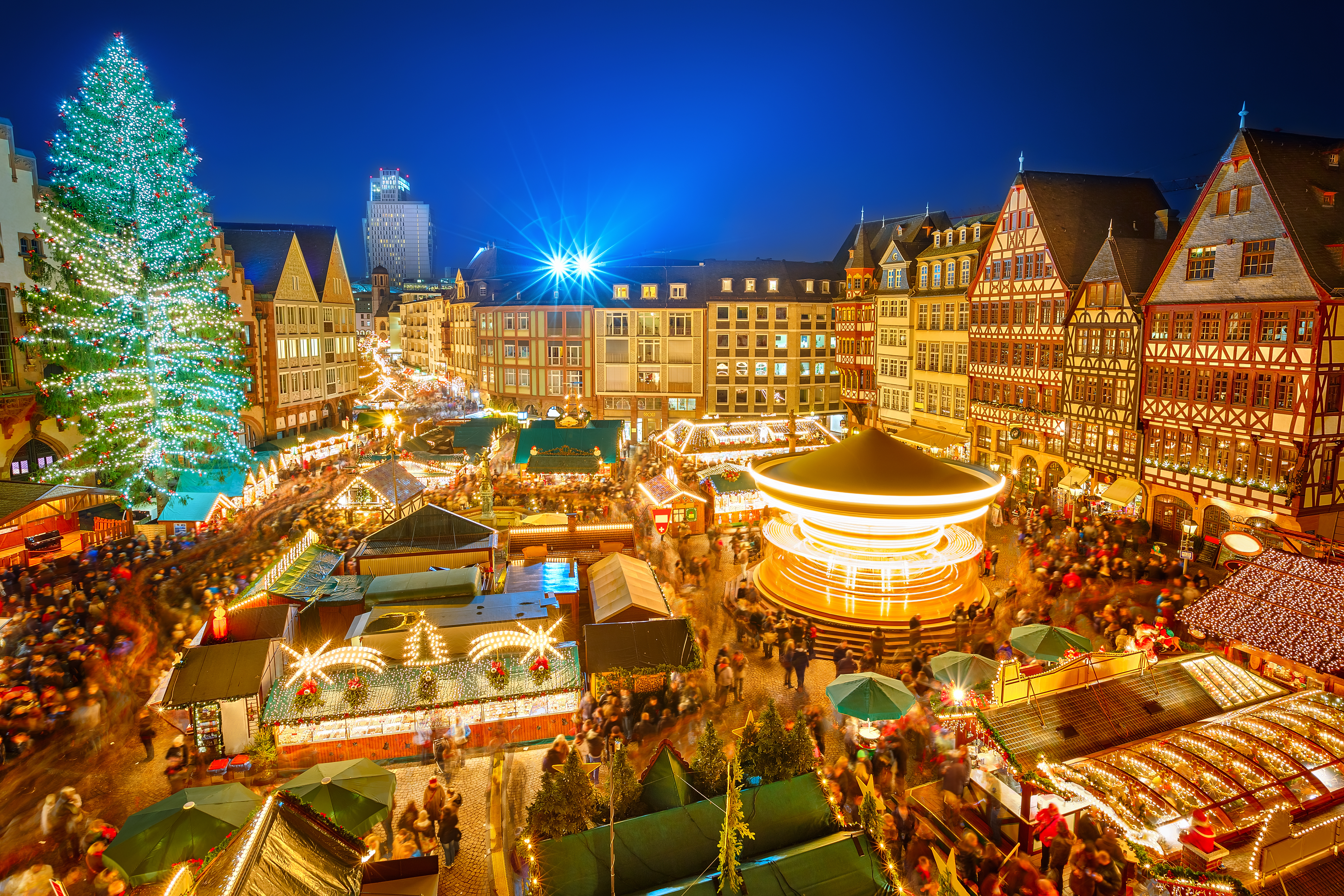 Traditional christmas market in the historic center of Frankfurt. View from above at night