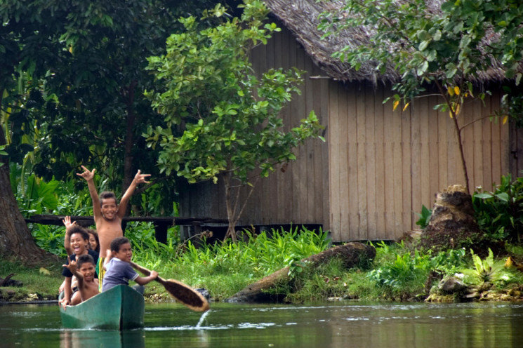 Kids in Canoe on Rennell Island
