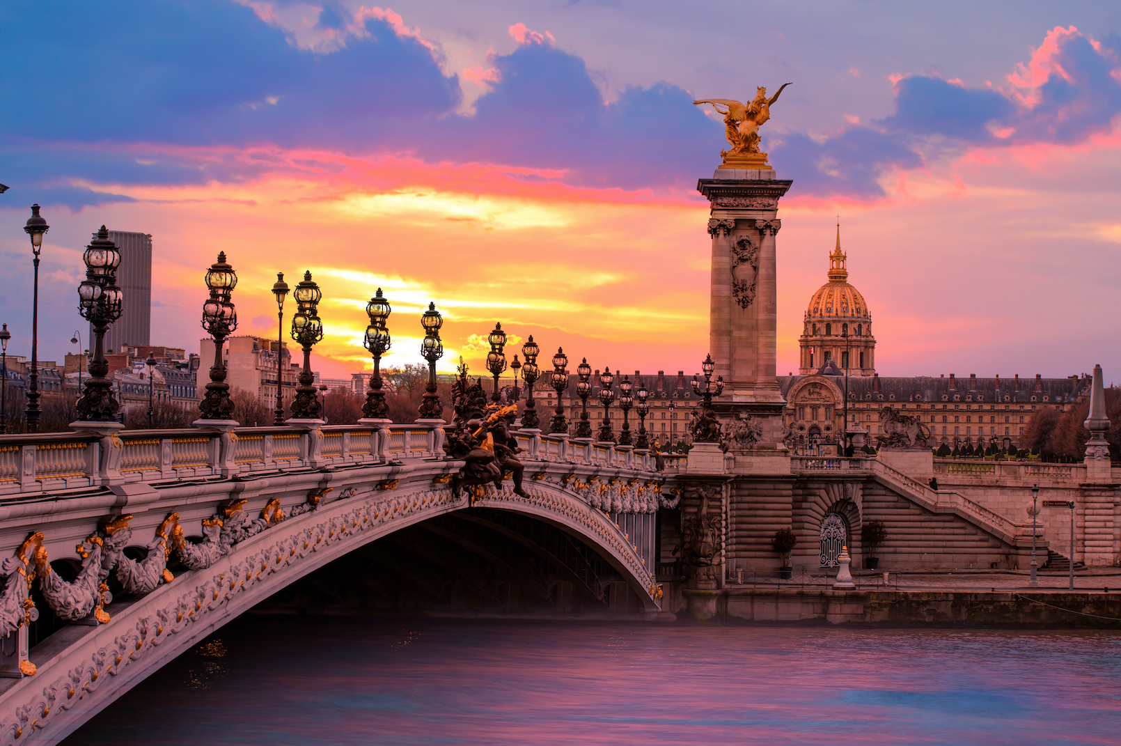 Sunset with view of a Paris bridge.