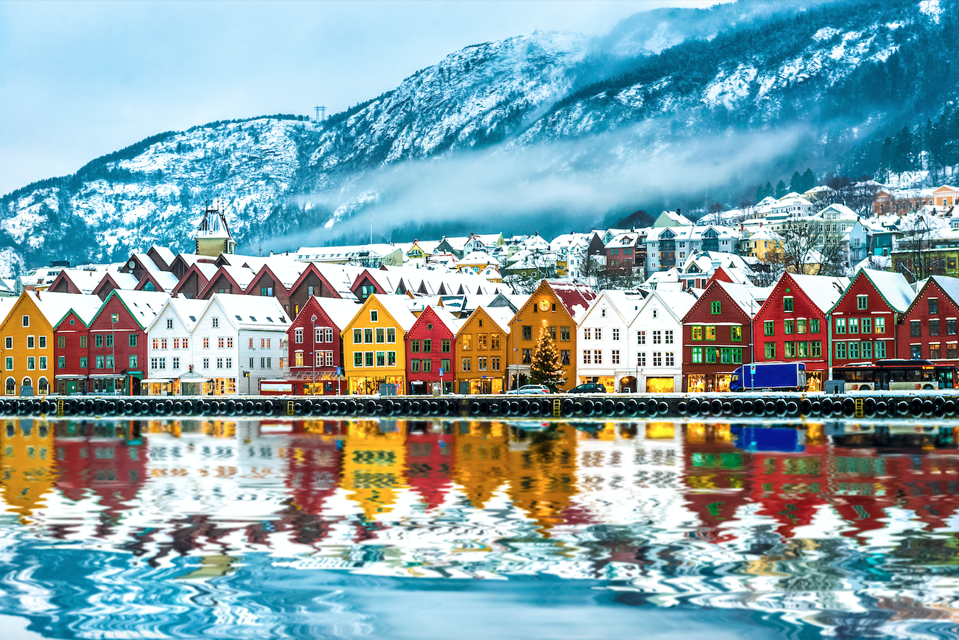 View from a lake on historic and colorful Bergen buildings in winter.